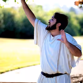 The overconfident Nick Bottom regales his companions with dramatic gestures to prove his acting prowess in the play A Midsummer Night's Dream.