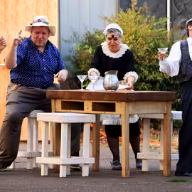 Drunken revelers Feste, Sir Toby Belch, and Sir Andrew Aguecheek grow increasingly rowdy as the maid Maria admonishes them for their cacophony in the play Twelfth Night.