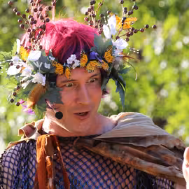 The fairy king Oberon divulges his plan to ensare his wife Titania with a mischievous smile.
