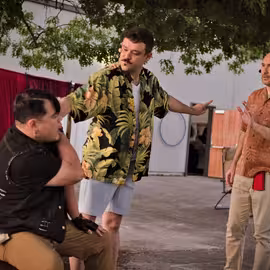 Don John provokes Claudio with falsehoods about the chastity of his betrothed Hero as Don Pedro responds with concern in the play Much Ado About Nothing.