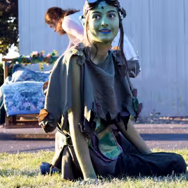 The trickster spirit Puck gleefully watches the mortals succumb to a love spell in the play A Midsummer Night's Dream.