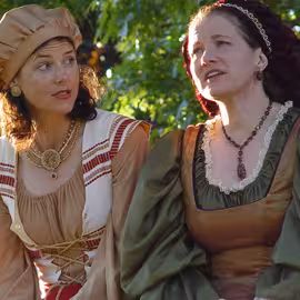 Mistress Ford and Mistress Page plot to outsmart their faithless suitor Falstaff in the play The Merry Wives of Windsor.