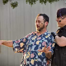 The malevolent Don John plots mischief with his cohort Borachio in the play Much Ado About Nothing.